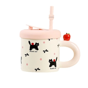 Cute ceramic mug with pink lid, straw, and 3D black cat decoration on white background