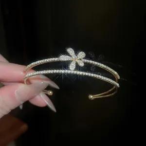 Elegant gold double-layered open cuff bracelet with sparkling zircon flower for women
