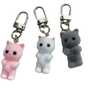 Cute flocked cat keychains in pink, white, and grey with sweet Y2K bow details