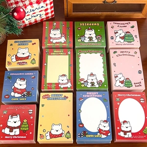 Multiple Christmas cartoon puppy memo pads with festive decorations and holiday greetings