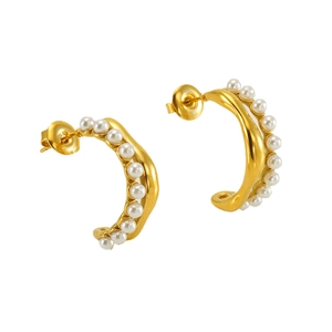 Detailed view of gold C-shaped earrings set with elegant white pearls on white background