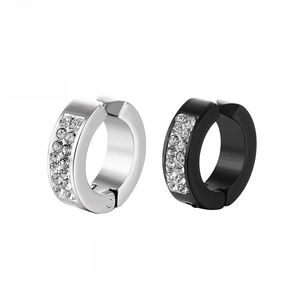 Close-up of silver and black stainless steel ear clips with paved crystal rhinestones