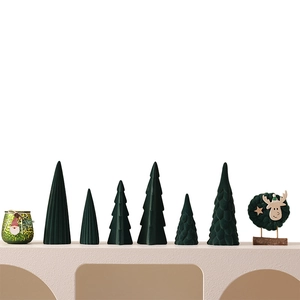 Set of eight deep green flocked ceramic Christmas trees with candle holder and deer star decor