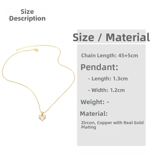 Detail view of heart pendant necklace with gold plating and dimensions showing 1.3cm size