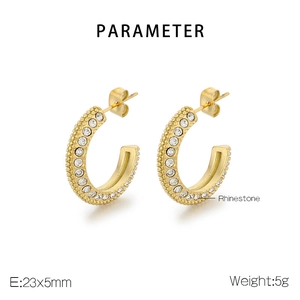 Detailed view of gold C-shape stud earrings with rhinestones and micro-bead metal craft
