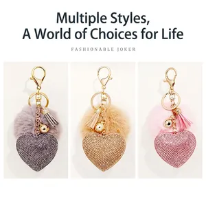 Funkelnder Herz-Schlüsselanhänger mit Samt-Pompon und Quaste in Lila, Gold und Rosa
