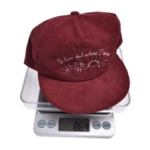 Weight display of burgundy corduroy baseball cap with mountain cactus embroidery