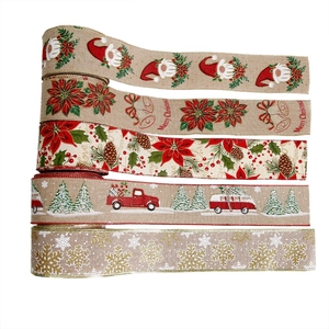 Five styles of Christmas burlap ribbons with pinecones and snowflake prints on white background