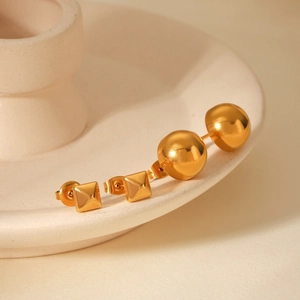 Minimalist 18k gold geometric ball and pyramid stud earrings in polished stainless steel