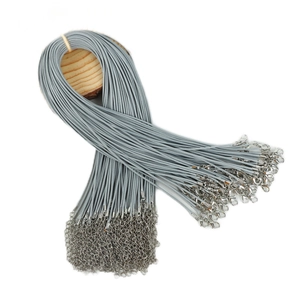 Bulk grey necklace cords with lobster clasp and extension chain on wooden base