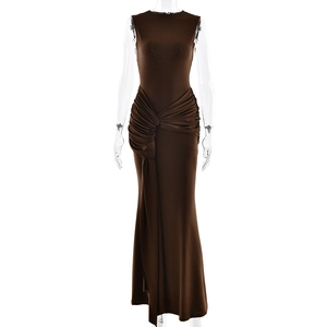 Detail of waist pleats and draped fabric on a brown sleeveless maxi dress