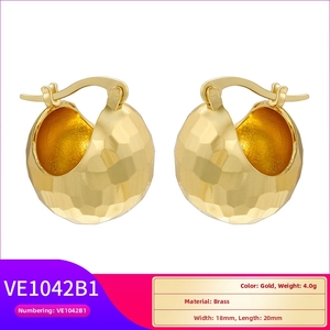 Detailed macro view of faceted hammered gold hoop earrings showing 18mm by 20mm dimensions