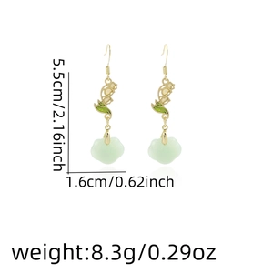 Detail view of green bamboo leaf earrings with dimensions 5.5cm height and 8.3g weight