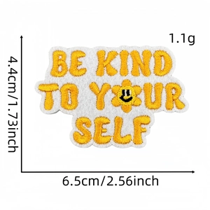 Detail view of Be Kind embroidery patch showing precise dimensions of 6.5cm by 4.4cm