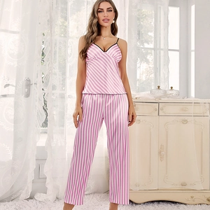 Chic pink and white striped satin pajama set featuring camisole top and long trousers