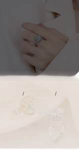 Macro detail of silver sunburst ring featuring cubic zirconia pavé and adjustable band
