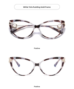 Detail of cat-eye frames with marble pattern and gold metal ring decoration