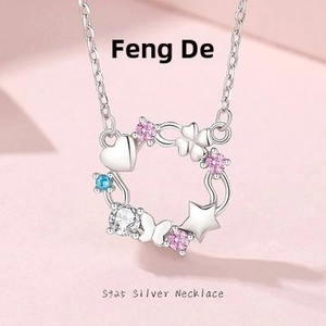 Detail of S925 silver necklace with floral wreath pendant and colorful zircon stones