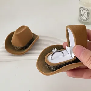 Creative brown flocked cowboy hat jewelry box for rings with woven metallic trim detail