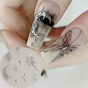 Detail of 3D liquid metal nail stickers with gothic moon, butterfly and star designs