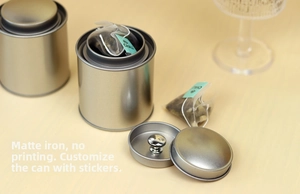 Detail of silver frosted matte iron tea tins with double-lid seal and minimalist design