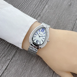 Detailed view of silver snake-head watch with crystal bezel and blue Roman numerals