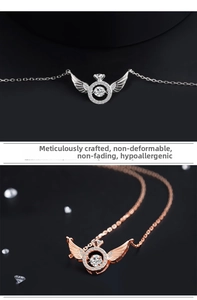 Macro detail of S925 sterling silver angel wing pendant with dancing stone in two colors