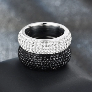 Macro shot of silver and black five-row crystal pavé titanium steel bands on display
