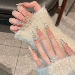 Pink aurora cat-eye press-on nails in long almond shape with rhinestone accents