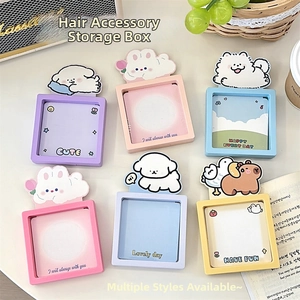 Macro detail of six colorful cartoon jewelry boxes with cute animal decor on a desk