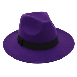 Detail of a dark purple wool fedora hat with a classic black ribbon band on a white background