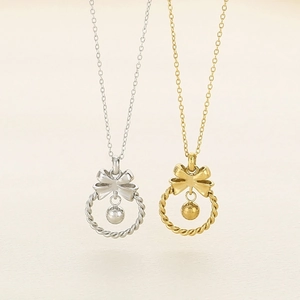 Collier avec pendentif couronne à nœud doré et argenté et perle suspendue