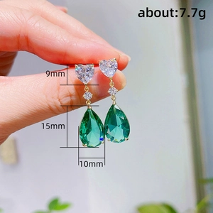 Elegant gold drop earrings with heart zircon and large pear-shaped green crystal gemstone