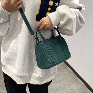 Vintage dark green corduroy Boston mini bag with adjustable strap and top handle