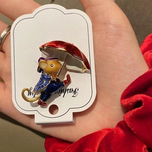 Cartoon enamel mouse holding a red umbrella brooch pin with blue sparkling rhinestones