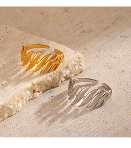 Detail of 18K gold and silver plated wave pattern rings with adjustable open band design