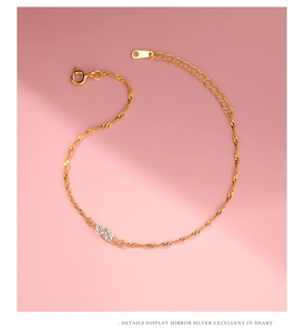 Close-up of gold twisted rope chain bracelet with sparkling round cubic zirconia