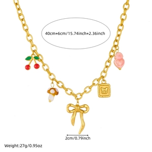 Gold chain necklace with cherry and bow pendants on a white background with size labels