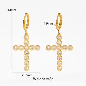 Detailed view of gold cross drop earrings with dimensions 44mm by 21.6mm and 8g weight
