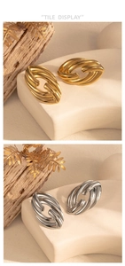 Detail view of twisted stainless steel oval earrings in gold and silver finishes