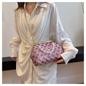 Detail of pink sequin crossbody bag with transparent beaded handle and metal chain