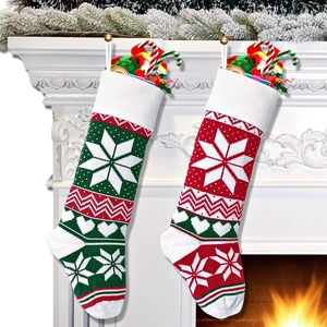 Pair of red and green knitted Christmas stockings with snowflake embroidery on fireplace
