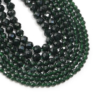 Macro shot of faceted green sunstone beads with golden shimmer for DIY jewelry making