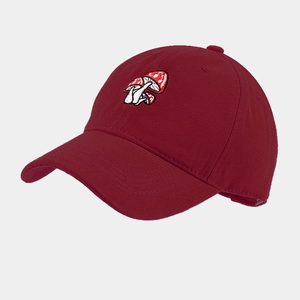 Close-up of three mushroom embroidery on dark red baseball cap with curved brim