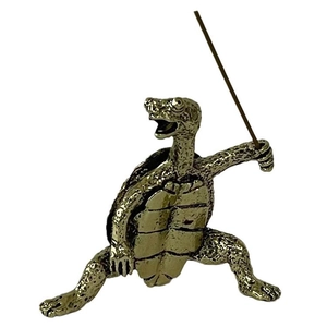 Macro detail of antique bronze tortoise incense burner with martial arts pose design