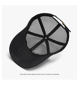 Detail of black mesh trucker hat interior showing stitching and adjustable metal buckle