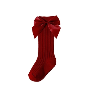 Red festive knit baby high socks with large satin bow for Christmas and New Year