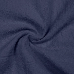 Detailed macro view showing the natural navy blue linen texture and fabric weave