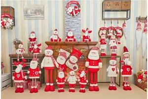 Detail of knitted Christmas gnomes and plush figurines in a cozy holiday fireplace setting