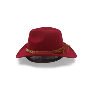 Detail of the woven geometric band and brown leather bow on a burgundy felt cowboy hat
